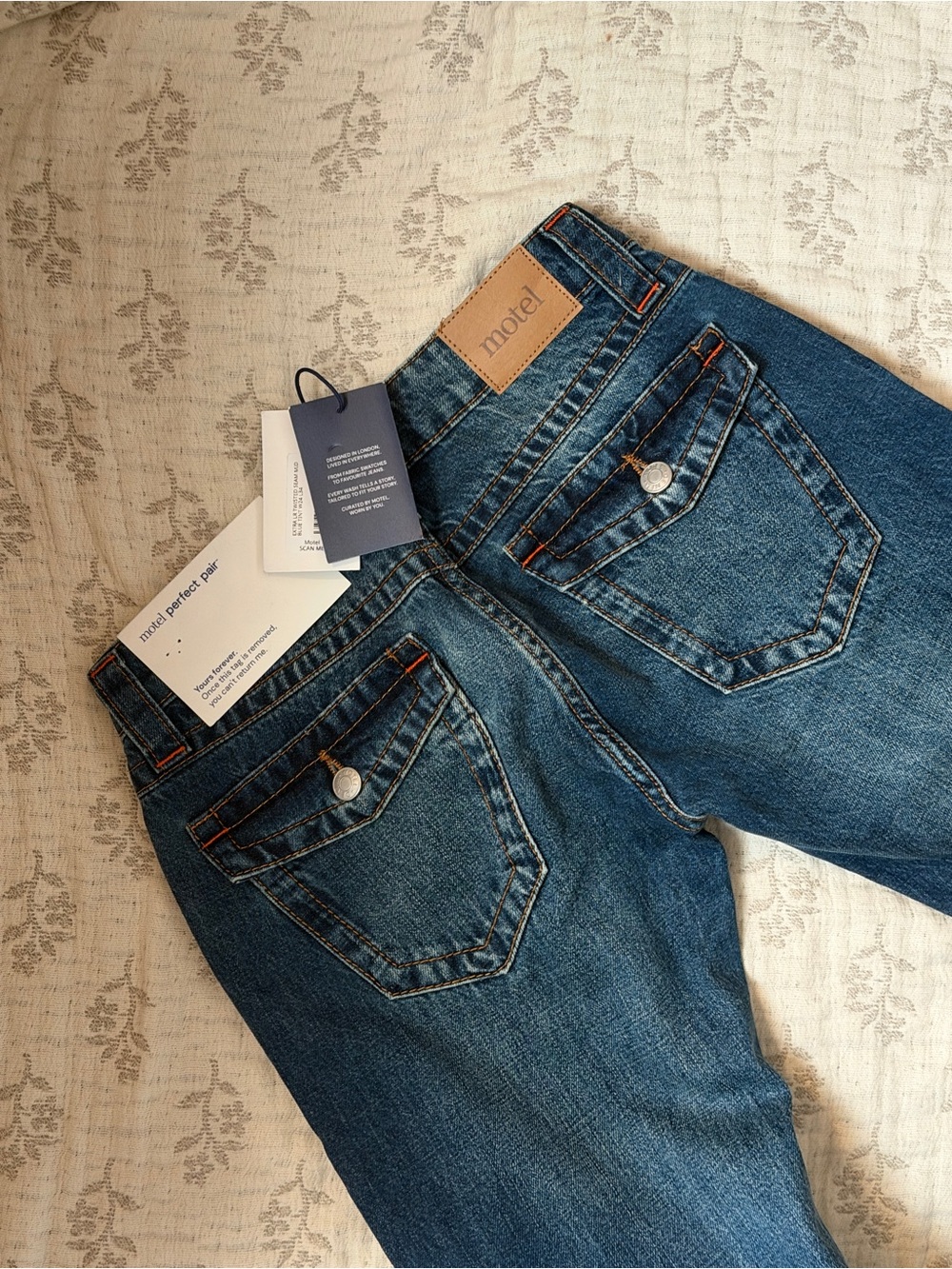Motel Rocks Extra Low Rise Twisted Seam Jeans in Mid Blue Tint